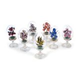 A set of seven Faberge style collectors eggs, each depicting bouquet of flowers, comprising The Carn