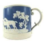 A 19thC Parian ware hunting scene porter mug, decorated with trees, dogs, and hunters riding and jum