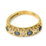 An 18ct gold sapphire and diamond dress ring, of half hoop design, set with four round brilliant cut