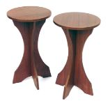 A pair of vintage teak laminate and plywood circular occasional tables, 62cm high.
