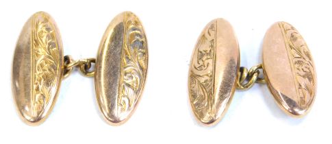 A pair of 9ct gold oval cuff links, each partially engraved with foliate scroll decoration, 3.06g.