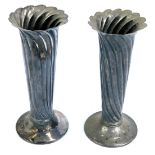 A pair of late Victorian silver specimen vases, of tapered form, with flared rims and plain circular