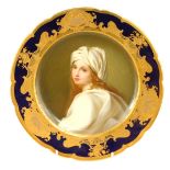 A late 19thC Dresden cabinet plate, with a central painted portrait of Beatrice Cenci, with a royal
