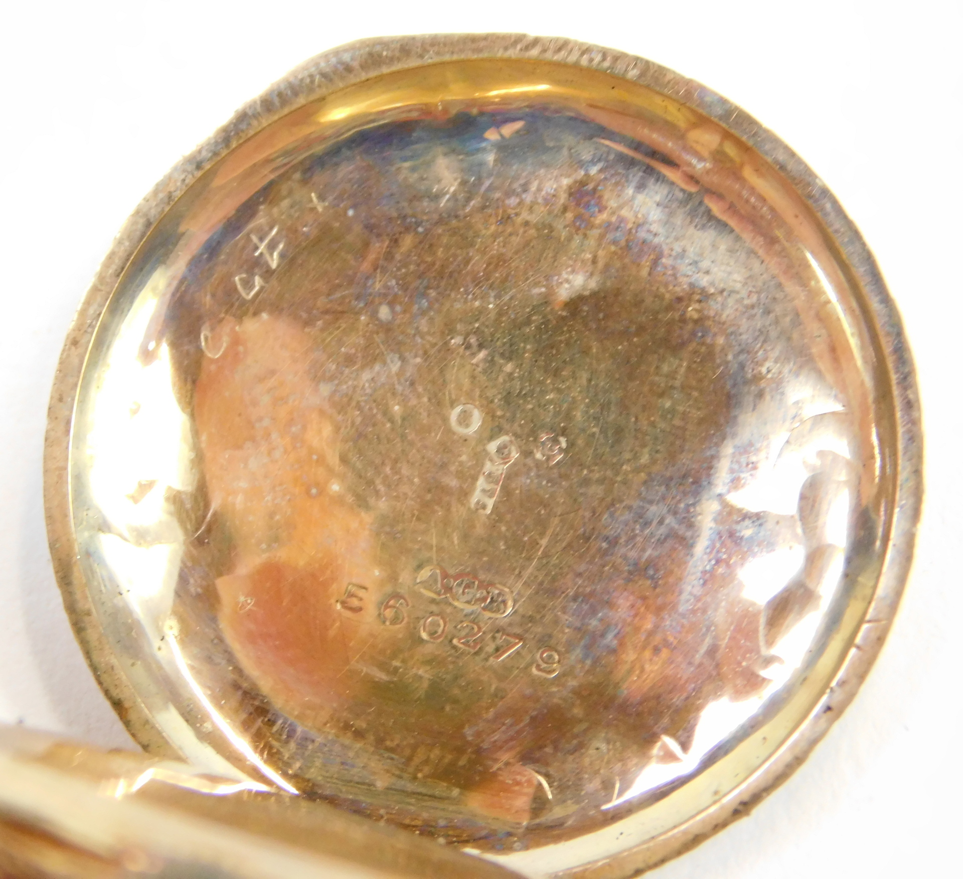 A 9ct gold fob watch, with heavily scroll design case and a vacant shield, with a white enamel Roman - Image 3 of 4