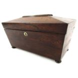 A 19thC rosewood sarcophagus shaped caddy, with a canted top with mother of pearl key lock, on bun f