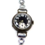 A silver cased wristwatch, with a blackened numeric dial, with white numbers and seconds dial, with