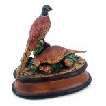 A ceramic tureen, with decoration of pheasant and grouse, on oval base, signed to base Diane Gerrard