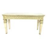 A Neoclassical style marble topped and cream painted console, with a floral carved frieze, raised on