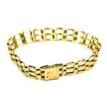 A 9ct gold gate bracelet, of three bar design with safety clip clasp, 18cm long, 12.7g all in.