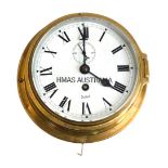 A Sestrel brass cased ship's clock, with white enamel Roman numeric dial, seconds subsidary dial, ma