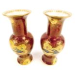 A pair of Carlton ware bird lustre vases, of baluster form, decorated with yellow and gilt reserves