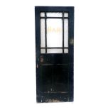 An early 20thC black painted and scumbled wooden Bar door, with upper frosted glass panels, 203cm x