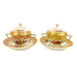 A pair of KPM Berlin porcelain chocolate pots, each with hand painted floral lid and gilt decoration