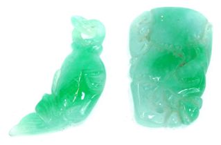 Two carved jade pendants, one in the form of a fish, with ring loop, 4.5cm, the other carved in a na