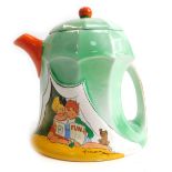 A Shelley teapot, on a green ground with orange handles and spout, with painted scene of children in