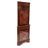 An Edwardian mahogany and inlaid standing corner display cabinet, the pediment with foliate inlay, o