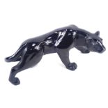 A Daum black glass figure of a prowling leopard, bearing signature Daum France, 30cm wide, boxed.