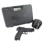 A Sig Sauer P226 reel action marker air soft pistol, and safety headphones, in plastic carry case.