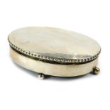A Danish white metal jewellery box, of oval form with a rope twist border, on four bun feet (one loo