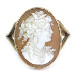 A 9ct gold shell cameo dress ring, cameo depicting female looking right, on V splayed shoulders, yel