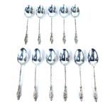 A set of eleven Edwardian silver Apostle handled coffee spoons, Chester 1902, total weight 3.92oz.