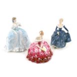 Three Royal Doulton and other figures, comprising Royal Doulton Victoria, HN2471, Fragrance HN2334,