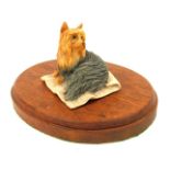 A Border Fine Arts figure of a seated terrier, marked Ayres, on a circular plinth base, 15cm diamete