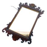 An 18thC style mahogany and parcel gilt fret work wall mirror, with a rectangular glass plate, 95cm