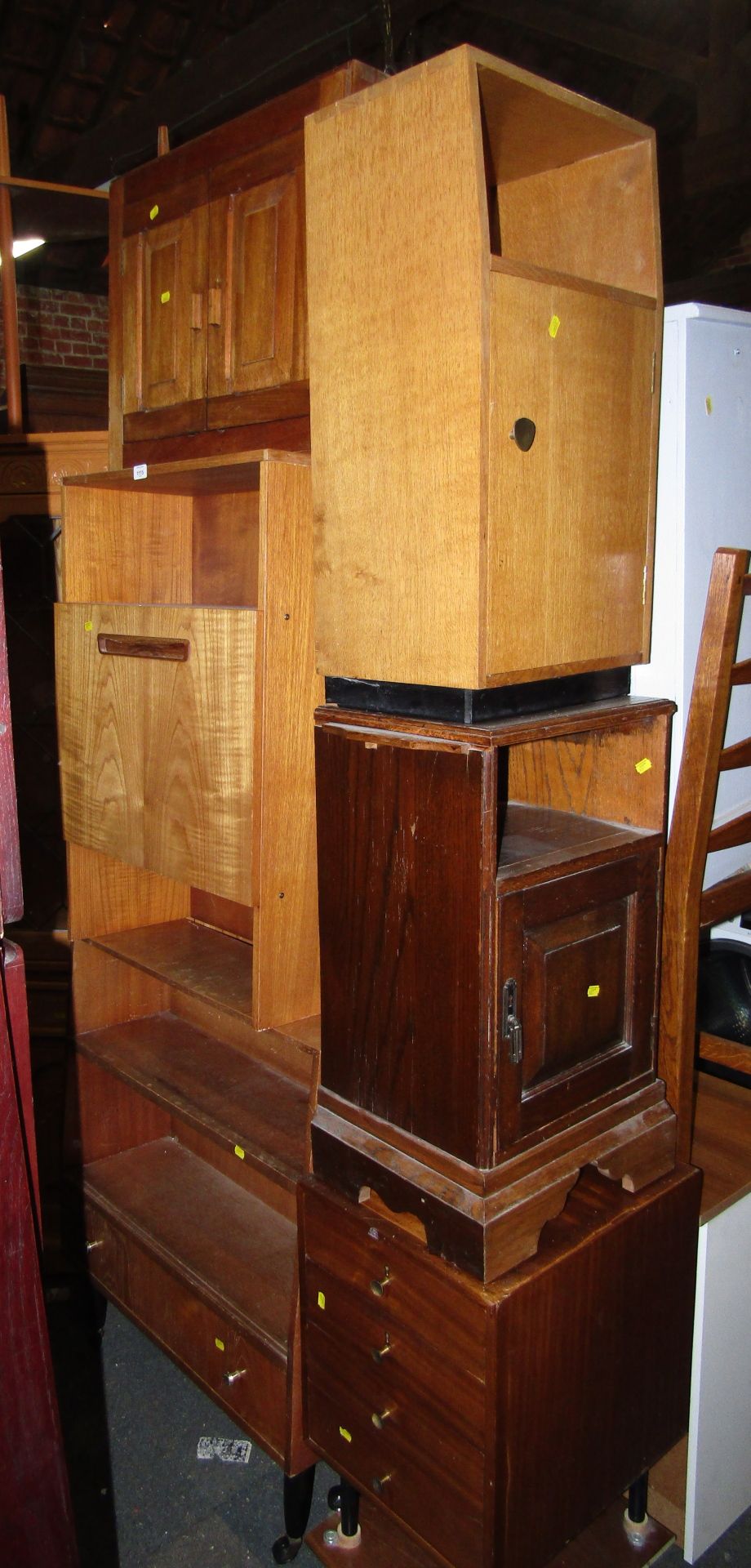 A teak hanging wall cupboard, teak bureaus, nest of pine drawers, and two pot cupboards. (6)