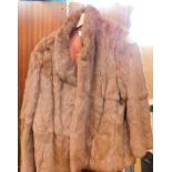 A lady's size 18 rabbit fur jacket.