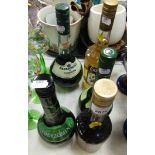 Five bottles of alcohol, including Freeze Mint, Apricot Brandy, and Creme de Cacao liqueur. (5)