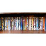 A quantity of DVDs, comprising Annie Hall, Into the Storm, Benidorm, and others. (1 shelf)