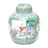 A Chinese porcelain famille verte ginger jar and cover, decorated with reserves of figures in interi