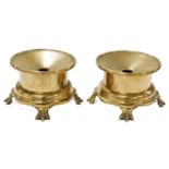 A pair of Chinese brass censers, of circular form, raised on a lappet base, on four claw feet, 20.5c