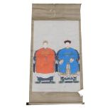 A Chinese ceremonial ancestor portrait scroll, depicting two seated family members, watercolour on s