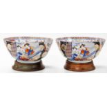 A pair of 20thC Japanese Imari bowls, decorated externally with figures on a floral ground, and on t
