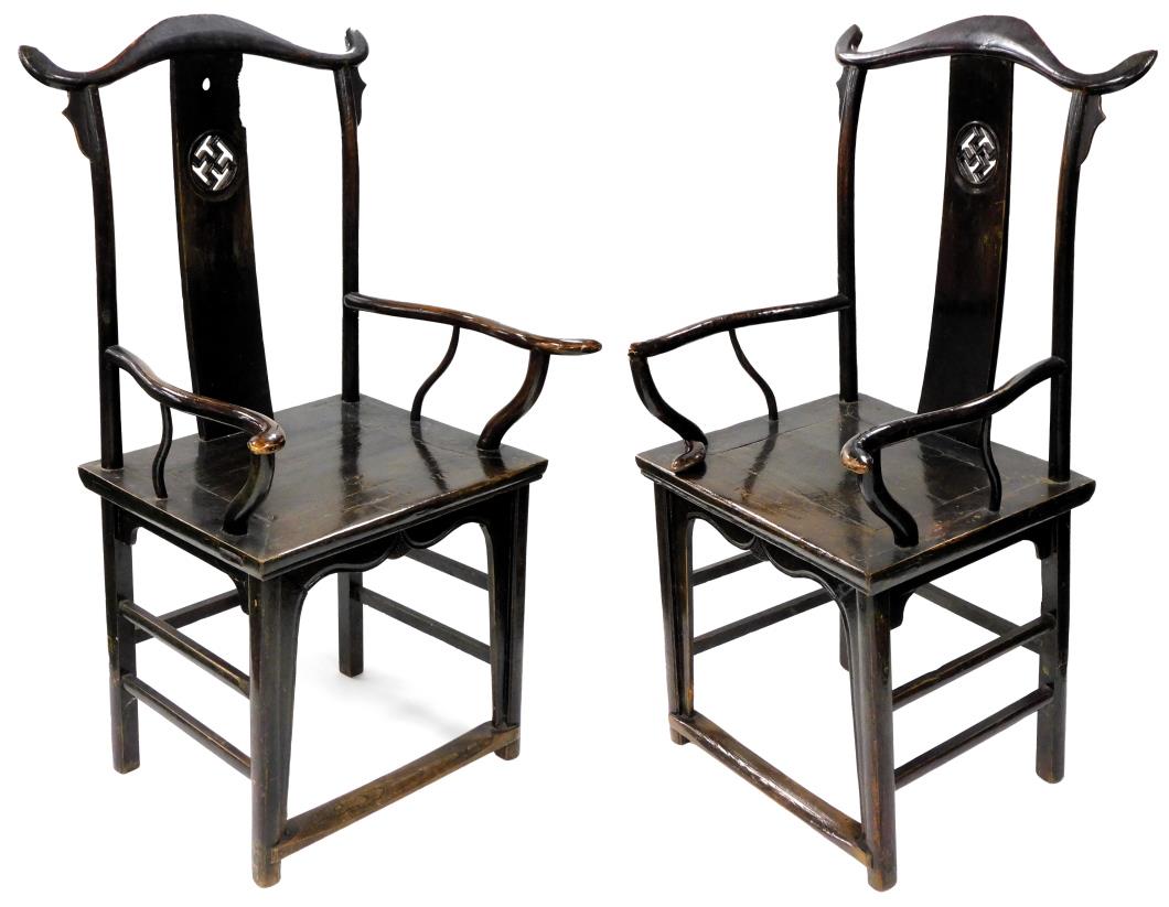 A pair of Chinese elm open armchairs, with Yoke backs, solid seats, shaped arms, raised on staggered