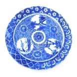 An early 20thC Japanese porcelain blue and white transfer printed charger, decorated with reserves o