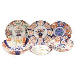 Four Japanese porcelain Imari dishes, each of scalloped form, variously decorated, together with two