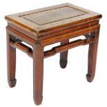 A Chinese hardwood occasional table, with pierced sides, raised on square legs, 50cm high, 52cm wide