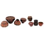 A group of Chinese red and black lacquer containers and vessels, variously decorated, three with lid