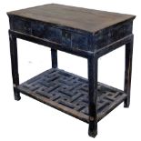 A Chinese Provincial side table, with drawers above pierced tier to base, 84cm high, 95cm wide, 58cm