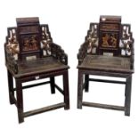 A pair of Chinese armchairs, with carved decoration.