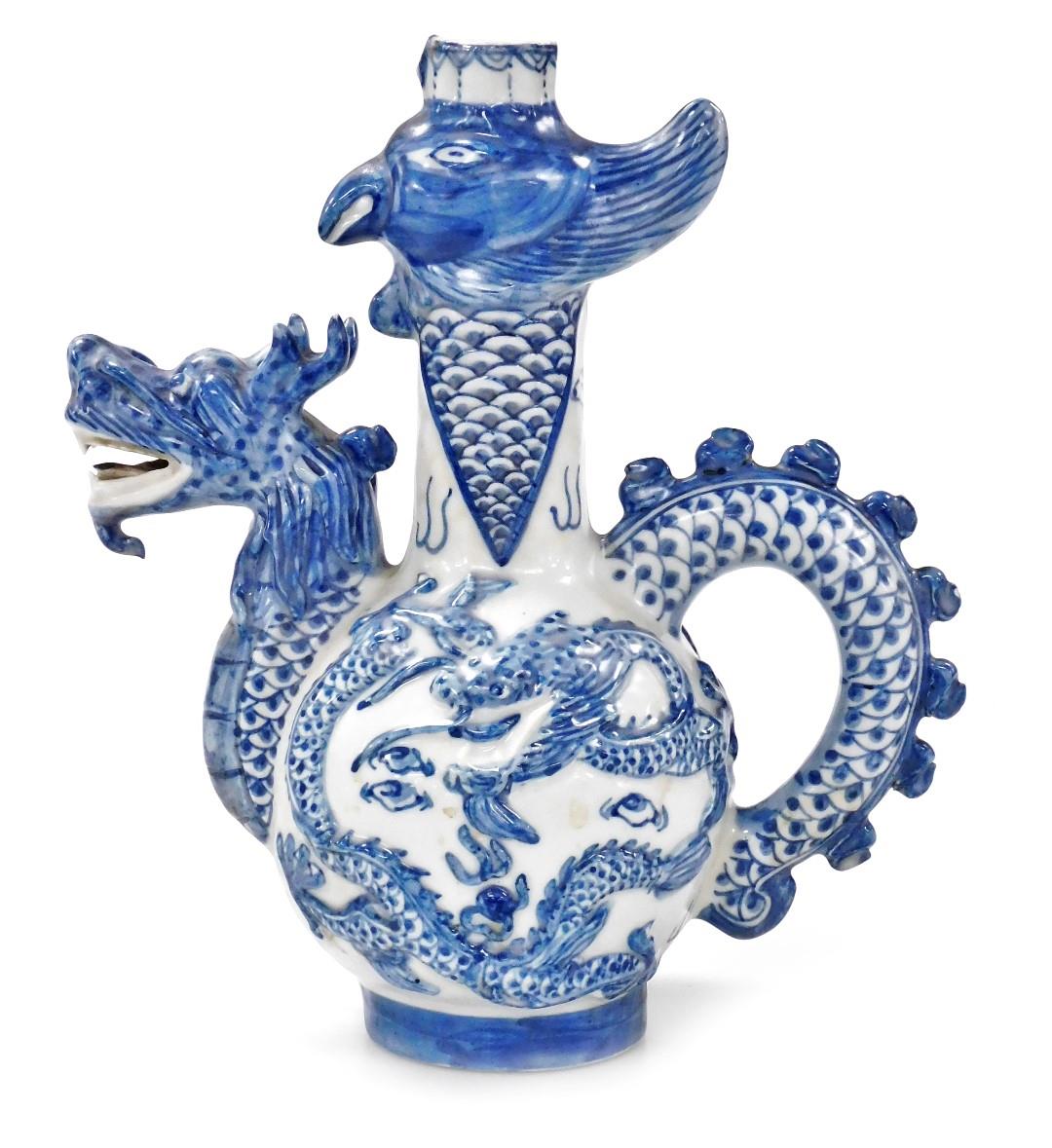A 20thC Chinese blue and white bottle jug, with a dragon's head spout and tail handle, the bottle wi