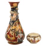 A Meiji period Satsuma vase, of teardrop form, moulded and decorated with dragons and immortals, mar