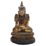 A Tibetan hardstone figure of Vajrasattva Buddha, with painted and gilded decoration, modelled seate