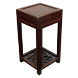 A Chinese hardwood tea table, 58cm high, 40cm square.