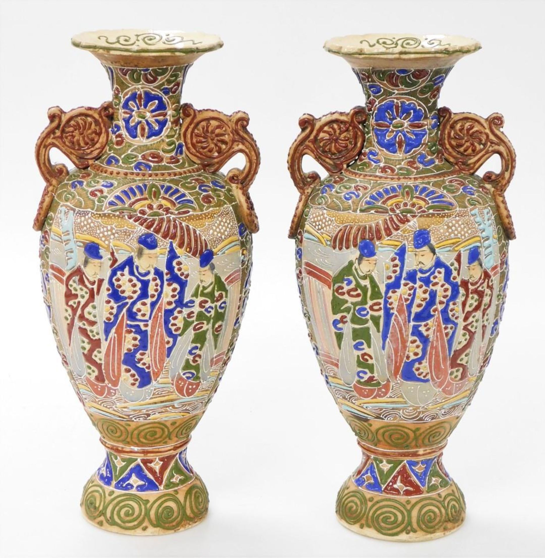 A pair of Meiji period Japanese Satsuma moriage vases, of twin handled baluster form, decorated with