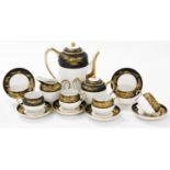 A 20thC Japanese eggshell porcelain coffee service, decorated with a band of matt black with gilt hi