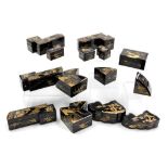 A collection of Oriental lacquered boxes, all with gilt decoration and variable shapes and sizes. (1